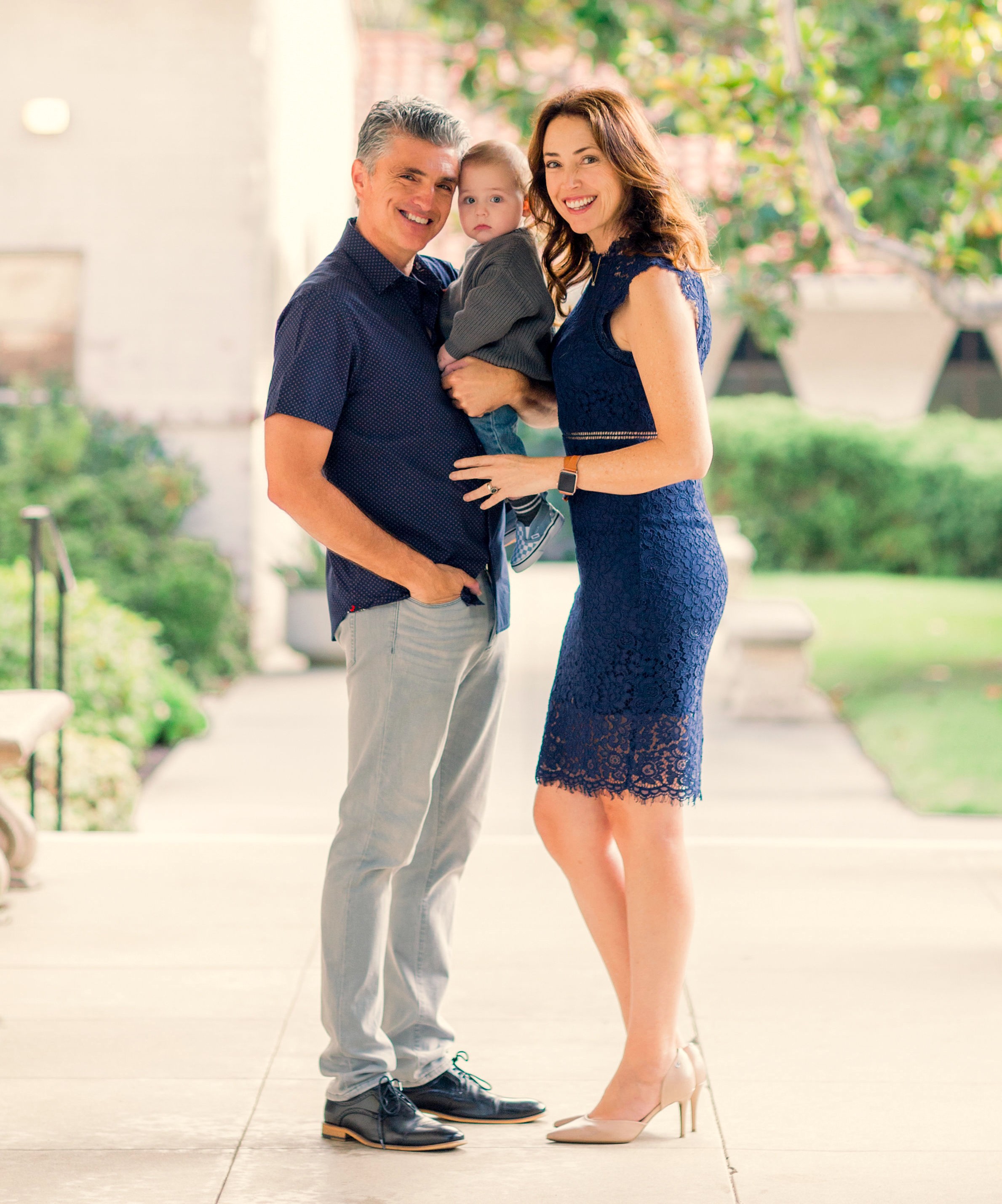 Carlos and Cindy from West Compass Insurance Solutions with their grandson.
